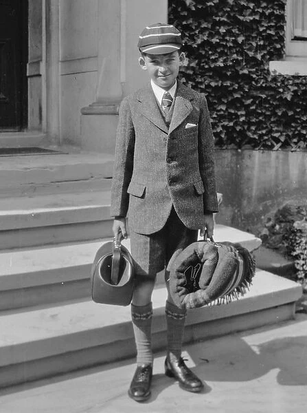 Boy in school uniform with luggage