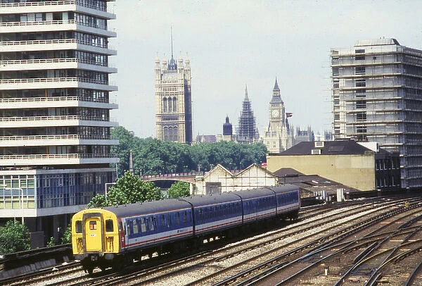 Electric train with Big Ben in the background, London