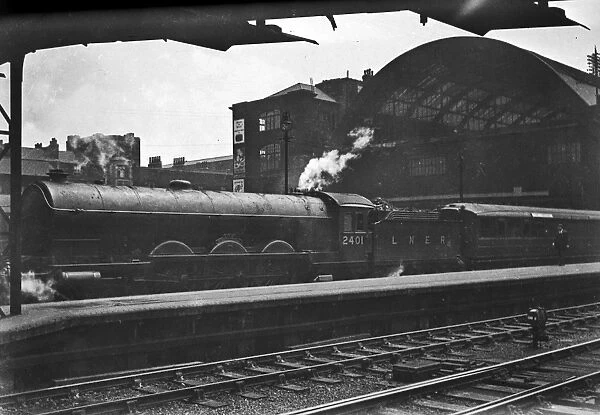 LNER steam engine outside a station