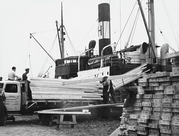 Unloading a Timber Boat
