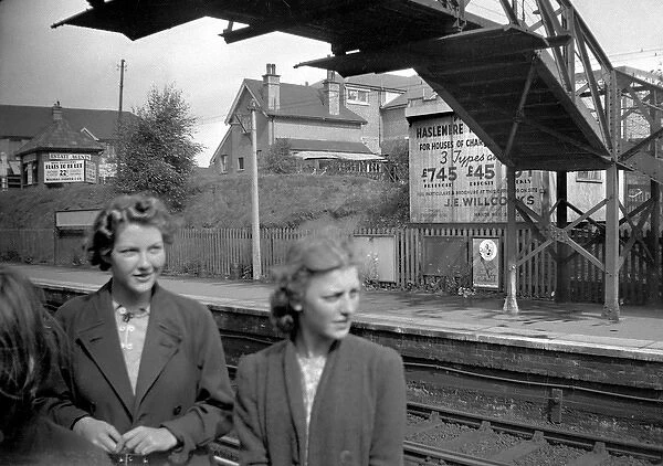 Two women at a railway station, South London