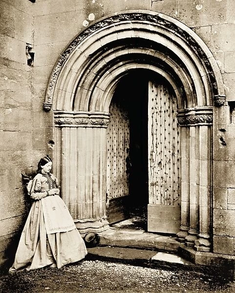 View of lady outside the North cloister doorway at Melrose Abbey. Date: 1866