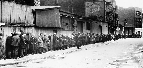 NEW YORK CITY: BREAD LINE. Unemployed workers on a bread line at McCauley Water Street Mission under the Brooklyn Bridge, New York. Photograph, c1930-1935