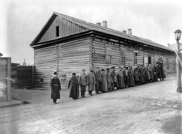 RUSSIA: PRISON CAMP, 1895. Russian convicts lined up outside a dormitory at Khabarovsk