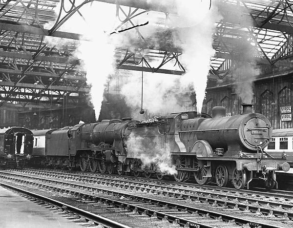 Class 2P 4-4-0 steam locomotive No 40651 and a rebuilt Royal Scot class steam locomotive