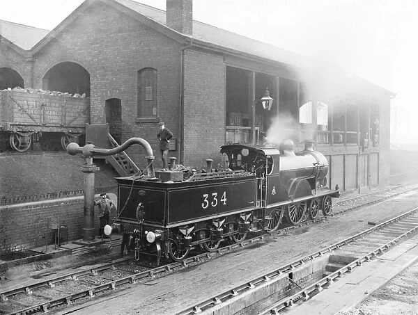 Locomotive taking water, 1909