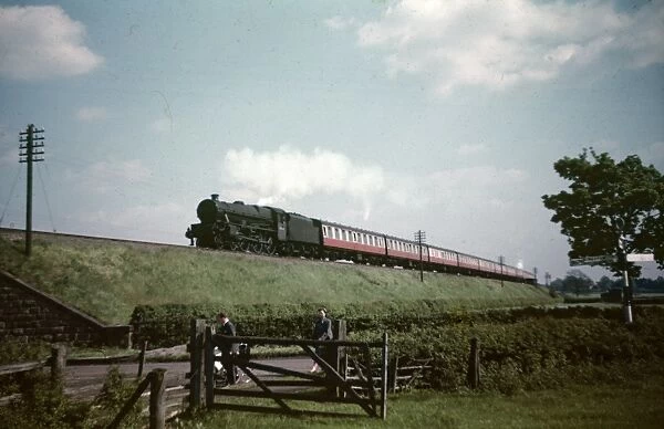 Train passing through the railway track, by J. F Henton. England, 1970s
