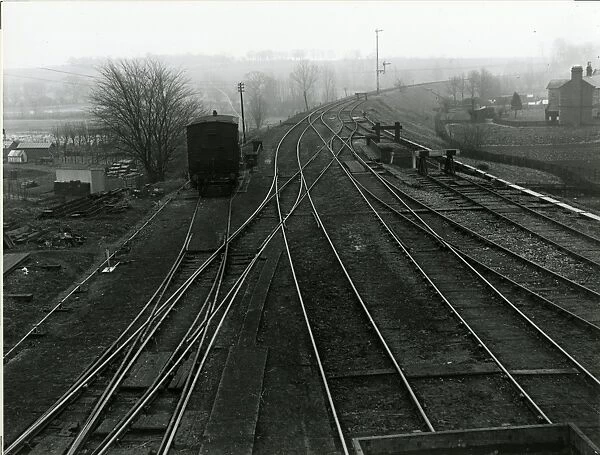 View looking east from signal post at Dunmow Station, about 1911. Station Road underbridge