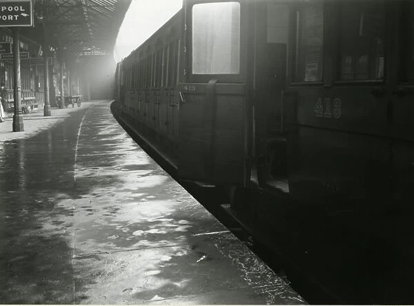 Wigan station, Lancashire & Yorkshire Railway. View of a train with a compartment door open