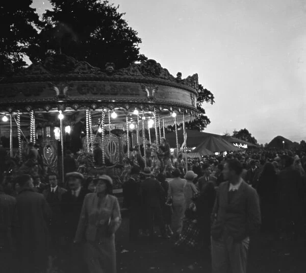 Children on the carousel at a fair in Blackfen, Kent. 1936