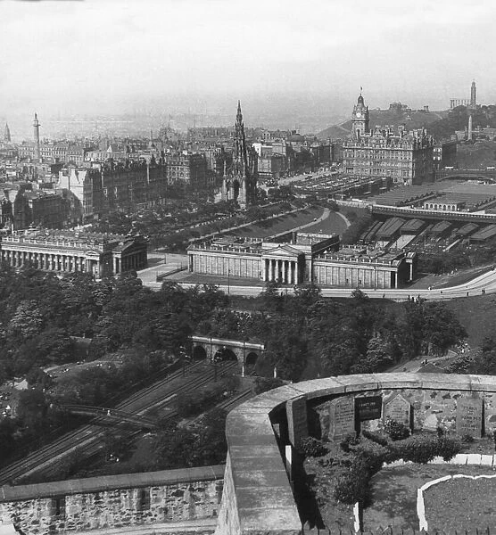 Historic image in black and white of Edinburgh, Scotland in the Victorian era with a view of Waverly railway station; Edinburgh, Scotland