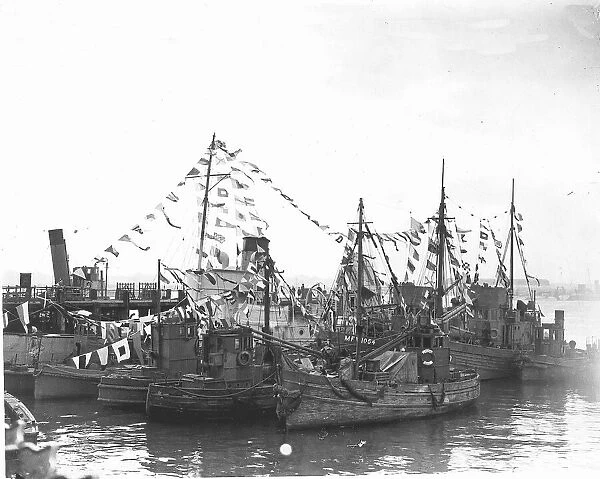 Boats in Southampton Docks decorated with flags at the end of WW2. 1945