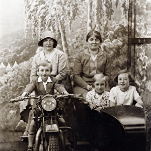 Ladies and children on a 1929 Coventry Eagle motorcycle & si