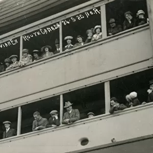 Passengers on the rail of the RMS Sacndinavian to Canada