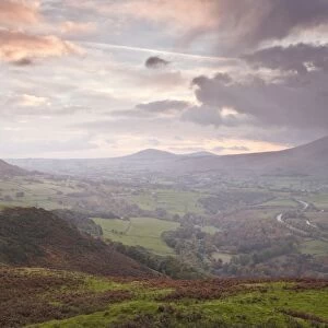 Rain clouds battle with the sunrise over the Lake District near to Keswick, Cumbria, England, United Kingdom, Europe