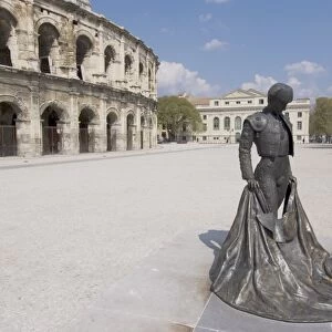 Roman arena with bullfighter statue, Nimes, Languedoc, France, Europe