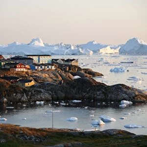 A view over houses and the Ilulissat Kangerlua Glacier also known as Sermeq Kujalleq