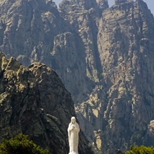 France, Corsica. Shrine to Our Lady of the Snows at Col de Bavella below pinnacles