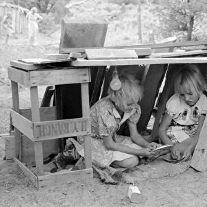 CHILDREN PLAYING, 1940. The Whinery children playing in their home in Pie Town, New Mexico
