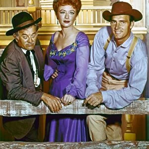 GUNSMOKE, c1960. Cast members Milburn Stone, Amanda Blake, and Dennis Weaver in a publicity photograph for the television series Gunsmoke, c1960