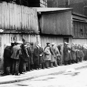 NEW YORK CITY: BREAD LINE. Unemployed workers on a bread line at McCauley Water Street Mission under the Brooklyn Bridge, New York. Photograph, c1930-1935
