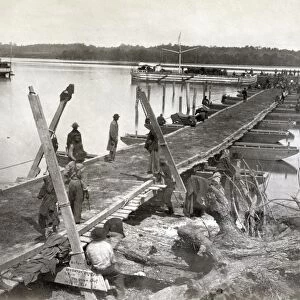 PONTOON BRIDGE, 1864. Pontoon bridge being built by the United States Military