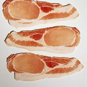 Three rashers of bacon, view from above