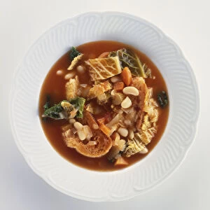 Ribollita, broth of cabbage, herbs, beans and vegetables, a typical Tuscan dish, view from above
