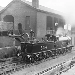 Locomotive taking water, 1909