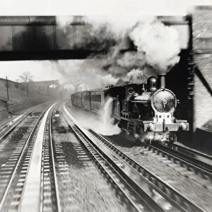 The London & North Western Railway locomotive Jeanie Deans picking up water at Bushey