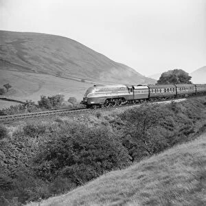 Steam locomotive with carriages, c 1950s