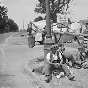 Road men taking tea in Eltham. 14 July 1937
