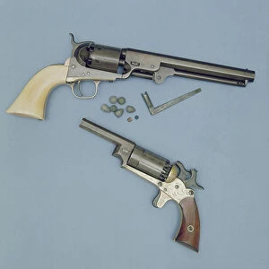 Colt Navy revolver, with ivory grips and brass trigger guard, shows L-shaped key for unscrewing nipples, together with caps and bullets (top); Walsh revolver, which used a cylinder holding 2 loads in each chamber, 1859 (below)