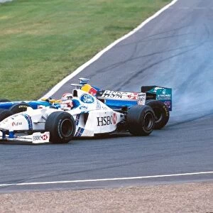 Formula One World Championship: Jan Magnussen Stewart Ford SF2, 6th place with a very sideways Johnny Herbert Sauber