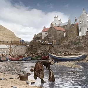 Frank Meadow Sutcliffe original of lady washing clothes at Staithes, hand coloured