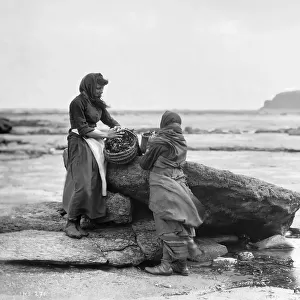 Frank Meadow Sutcliffe, photographer. Two fish wives with basket at Whitby