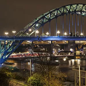 Illuminated Tyne Bridge Over The River Tyne At Nighttime; Newcastle, Tyne And Wear, England