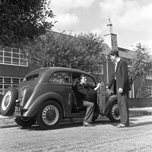 6th Form pupils of Bournemouth Grammar School seen here parking the car after driving to