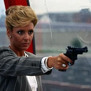 Diane Keen holding pistol gun August 1987