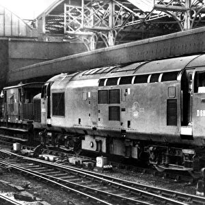 A double ended diesel electric locomotive and brake van in Newcastle Central Station