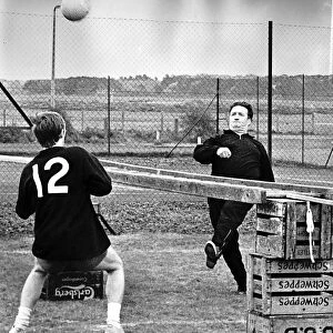 Jock Stein football manager Celtic FC training with Davie Hay kicking ball practice at