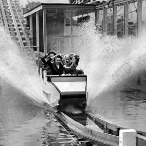 Making a splash at Battersea gardens, London. Photographs shows a merry party of some of