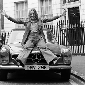 Model and actress Twiggy in London with her Mercedes sports car. 2nd June 1976