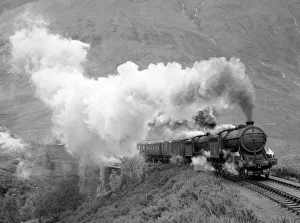 Photograph by Cyril Herbert showing a steam locomotive pulling an express train in Photograph by Cyril Herbert showing a steam locomotive pulling an express train in