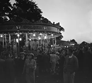 Children on the carousel at a fair in Blackfen, Kent. 1936